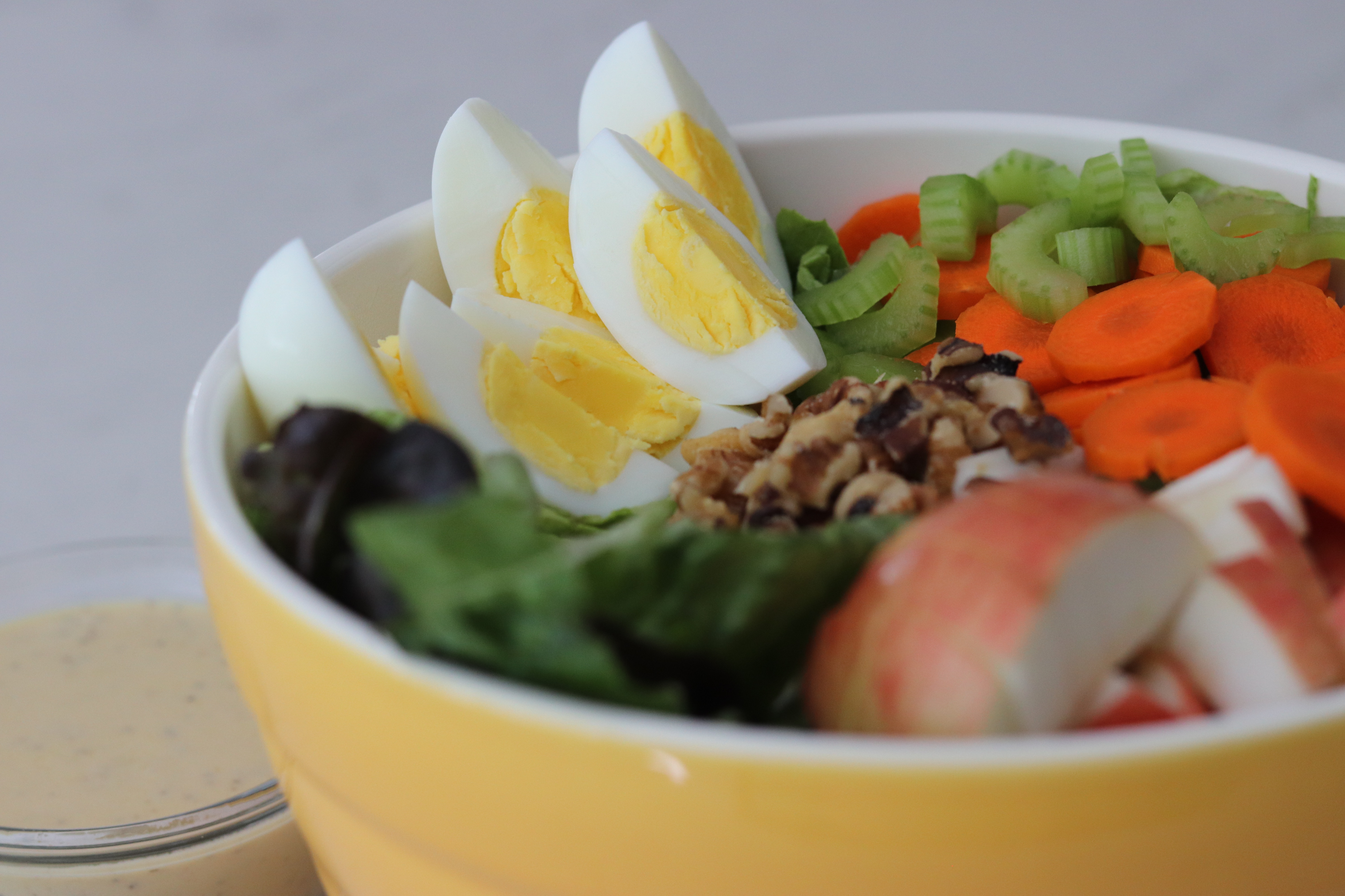 Fall Salad with Boiled Eggs and a bowl of Honey Mustard Dressing