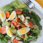 Plate with Fall Salad with Honey-Mustard Dressing and Boiled Egg, featuring romaine lettuce, celery, carrot, and apple