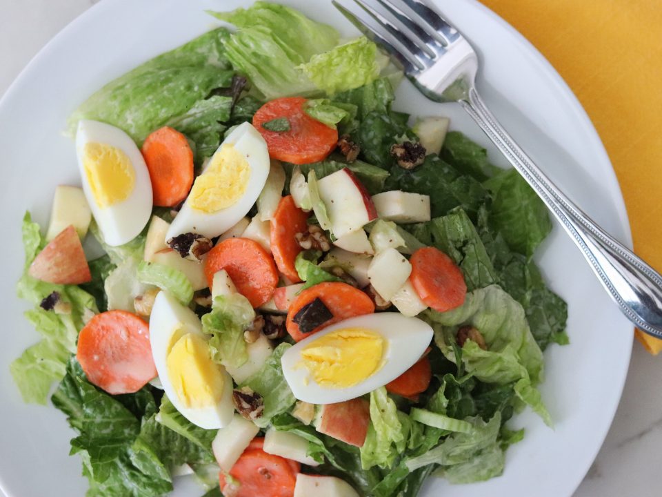 Plate with Fall Salad with Honey-Mustard Dressing and Boiled Egg, featuring romaine lettuce, celery, carrot, and apple