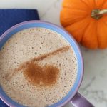 Healthy Pumpkin Spice Latte in a purple mug with a mini pumpkin