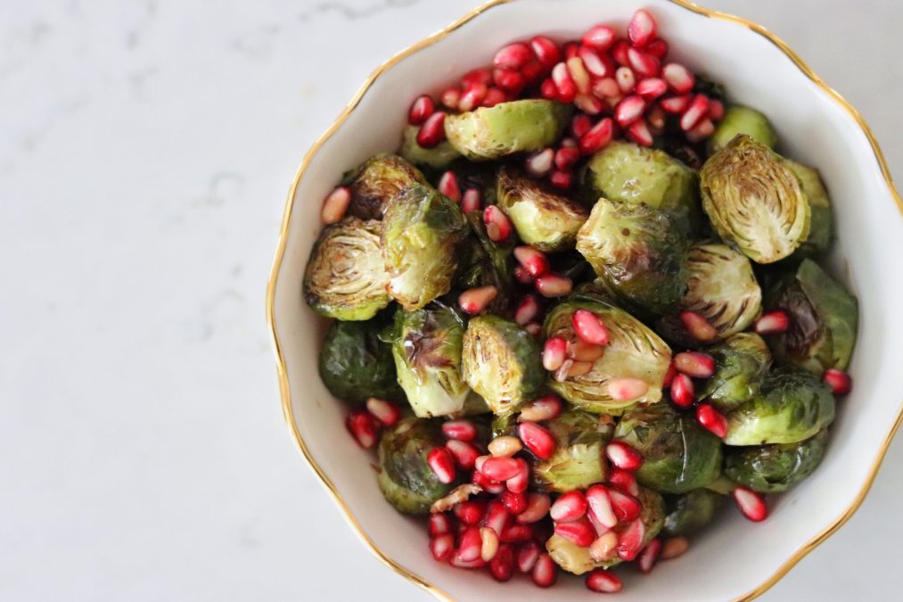 A bowl of Roasted Brussels Sprouts with Balsamic and Pomegranate Seeds