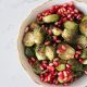 A bowl of Roasted Brussels Sprouts with Balsamic and Pomegranate Seeds