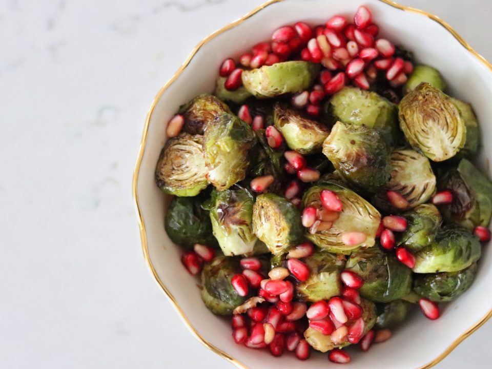 A bowl of Roasted Brussels Sprouts with Balsamic and Pomegranate Seeds