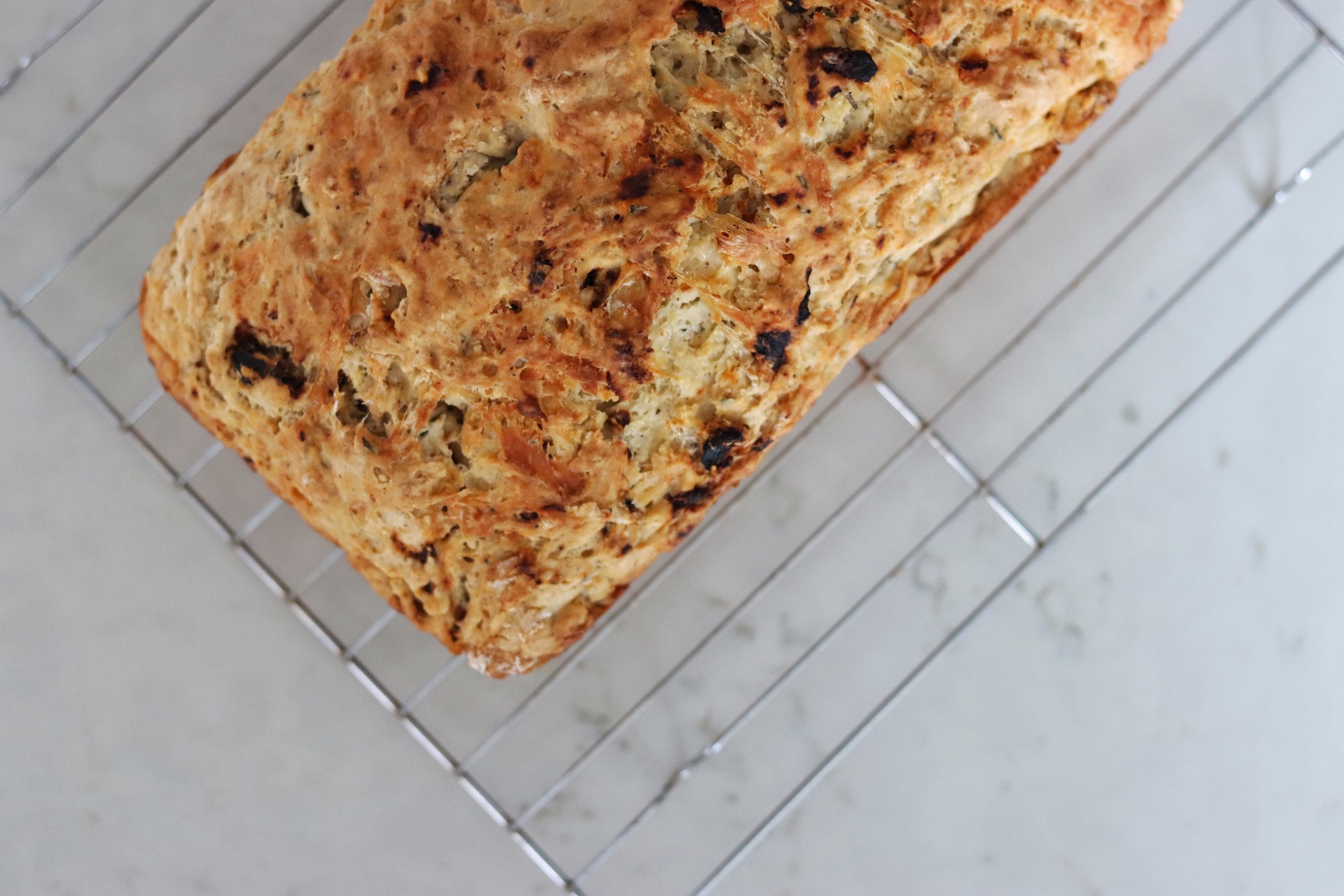 Cheesy Sun-Dried Tomato Beer Bread loaf from overhead