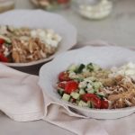 Instant Pot Greek Chicken Gyro Bowls with ingredients in the background