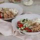 Instant Pot Greek Chicken Gyro Bowls with ingredients in the background
