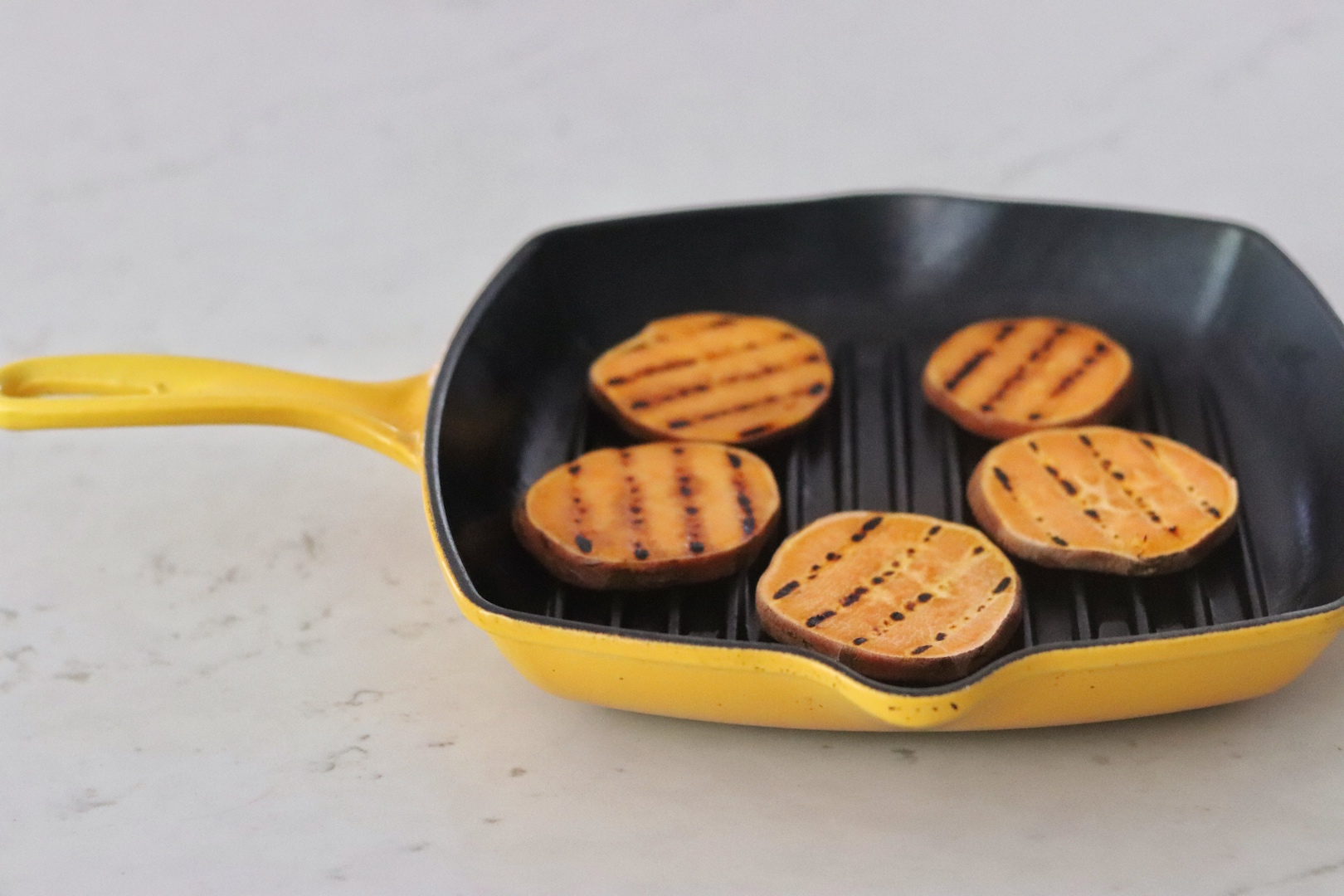 Sweet Potato Slider Buns in a yellow grill pan