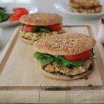 Flaxseed Quinoa and White Bean Burgers on a wooden cutting board