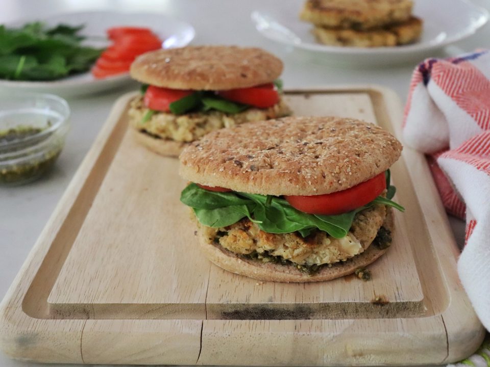 Flaxseed Quinoa and White Bean Burgers on a wooden cutting board